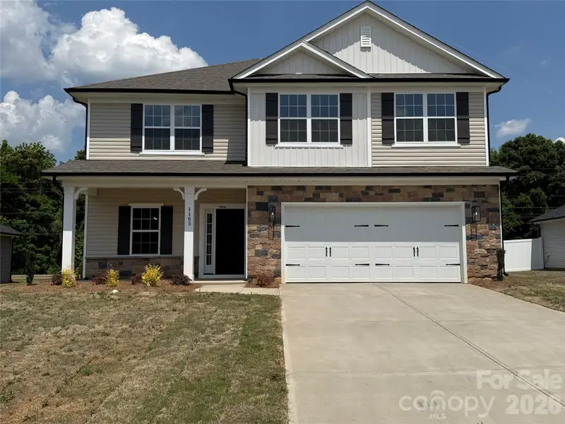 Front exterior of a new home in Kerns Ridge, Salisbury, NC, highlighting curb appeal (Image 2). Front exterior of a new home in Kerns Ridge, Salisbury, NC, highlighting curb appeal (Image 2).