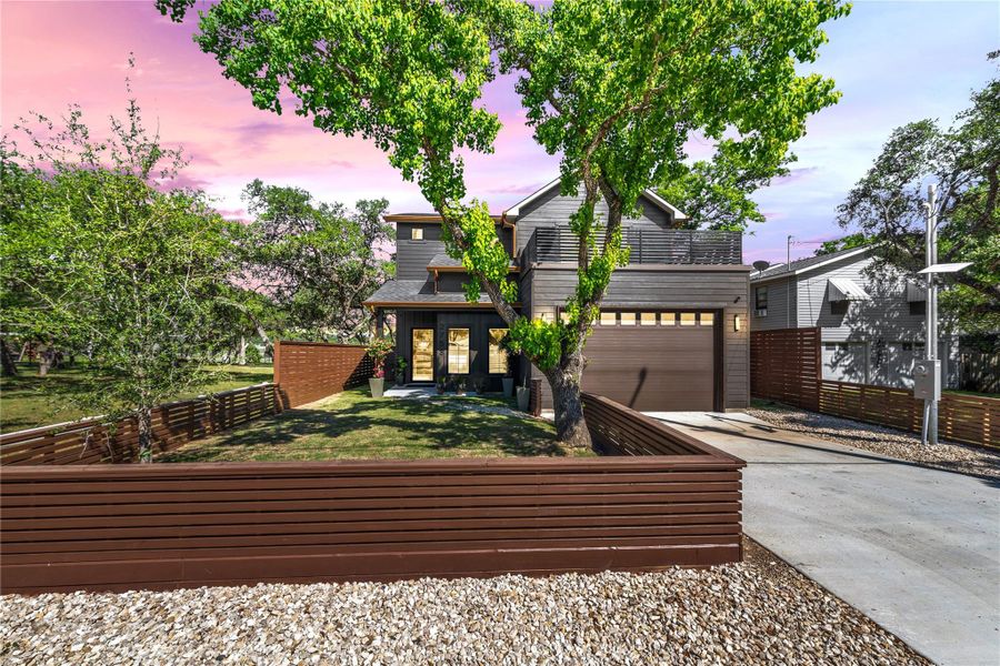 Modern Hill Country style meets warm curb appeal in this stunning Canyon Lake home. With clean lines, a spacious front patio, and an oversized garage, this home offers both striking design and everyday functionality just minutes from the lake.