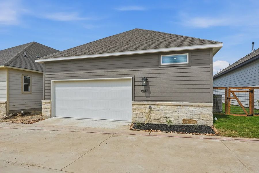 Front exterior of a new home in The Crossvine, Schertz, TX, highlighting curb appeal (Image 26).