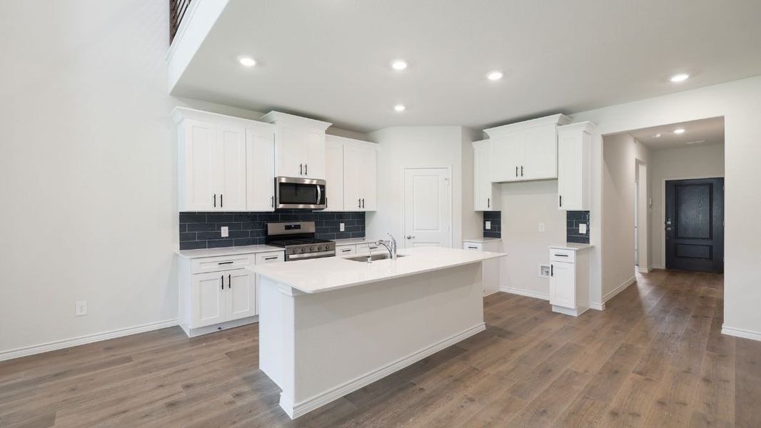 Representative furnished interior of a home built from the Burrow by D.R. Horton in The Landing at Hidden Lakes, McKinney (Image 3).