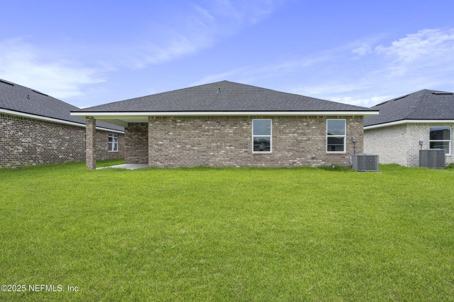 Front exterior of a new home in Shadow Crest at Rolling Hills, Green Cove Springs, FL, highlighting curb appeal (Image 17).
