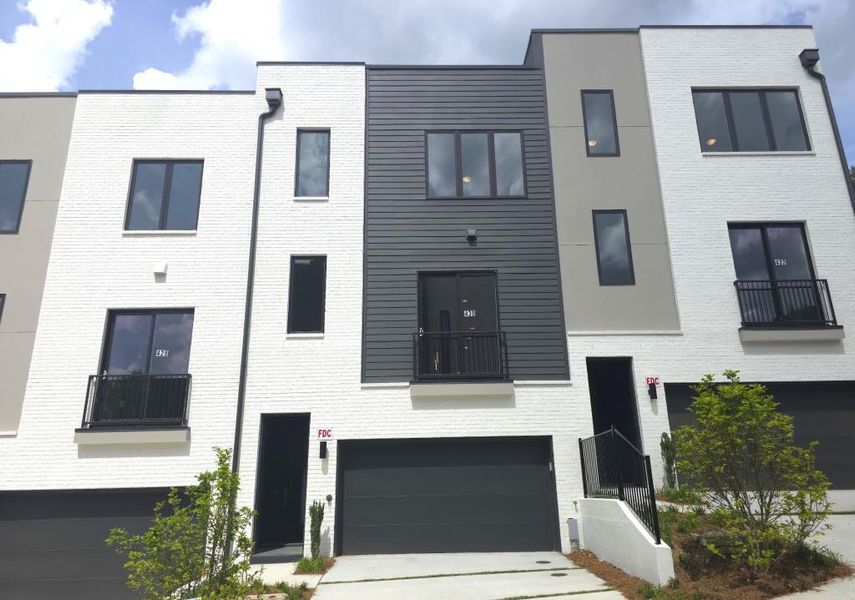 Front exterior of a new home in Overlook at Moda, Decatur, GA, highlighting curb appeal (Image 30). Front exterior of a new home in Overlook at Moda, Decatur, GA, highlighting curb appeal (Image 30).