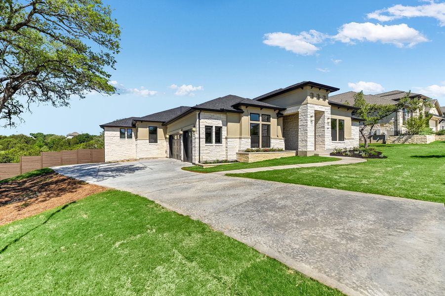 Representative exterior photo of a completed home built from the Sapphire by Giddens Homes in Riverstone, Georgetown, TX (Image 30).