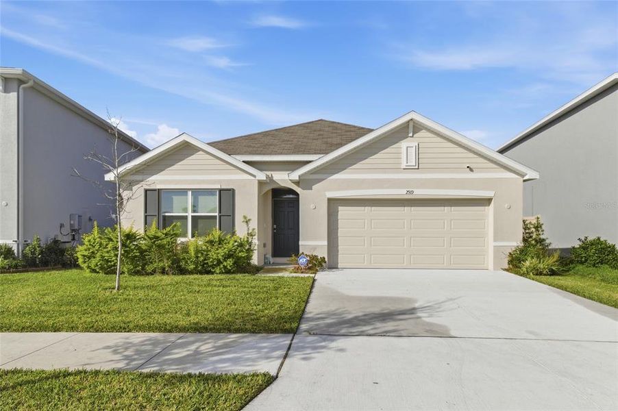 Front exterior of a new home in Northwater at Two Rivers, Zephyrhills, FL, highlighting curb appeal (Image 17).