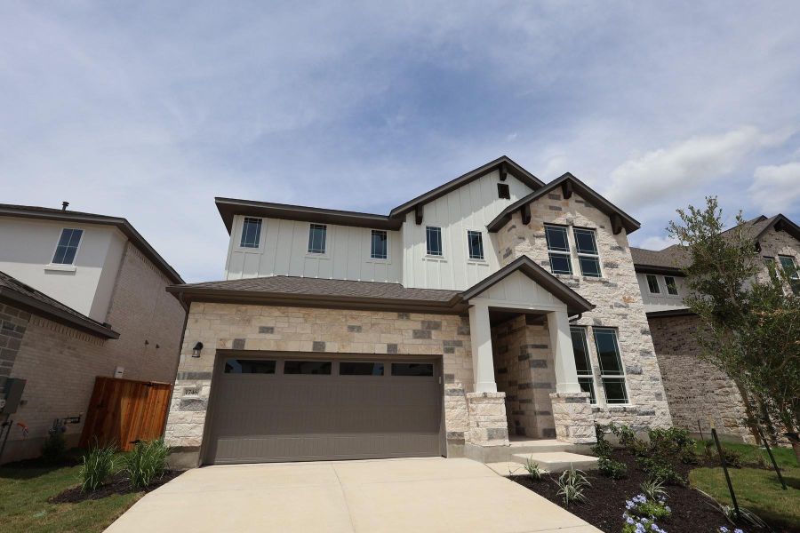 Front exterior of a new home in Homestead at Old Settlers Park, Round Rock, TX, highlighting curb appeal (Image 2).