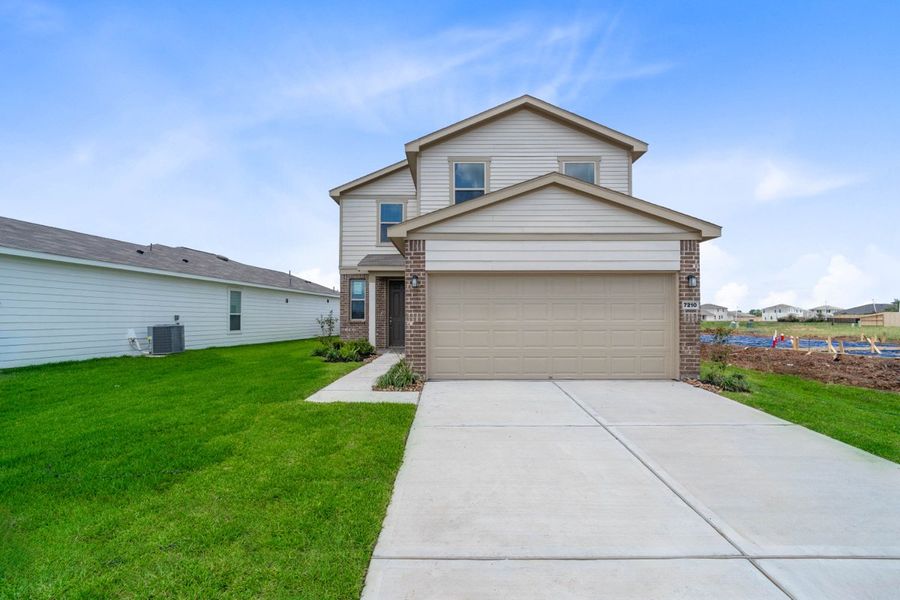 Front exterior of a new home in Saddlebrook Trails, Beasley, TX, highlighting curb appeal (Image 20). Front exterior of a new home in Saddlebrook Trails, Beasley, TX, highlighting curb appeal (Image 20).