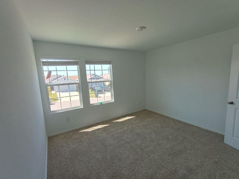 Spare room with carpet and baseboards Spare room with carpet and baseboards