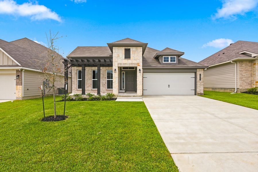 Front exterior of a new home in Gourd Creek, Bryan, TX, highlighting curb appeal (Image 1). Front exterior of a new home in Gourd Creek, Bryan, TX, highlighting curb appeal (Image 1).