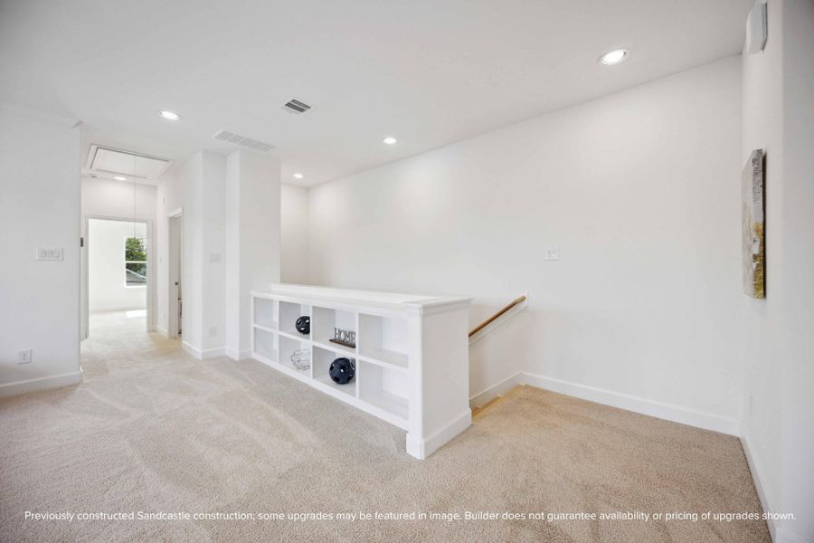 Entertainer's Nook: This game room is perfectly appointed with built-in shelves to showcase your interests and a ceiling fan above to ensure a cool, inviting atmosphere for every play.