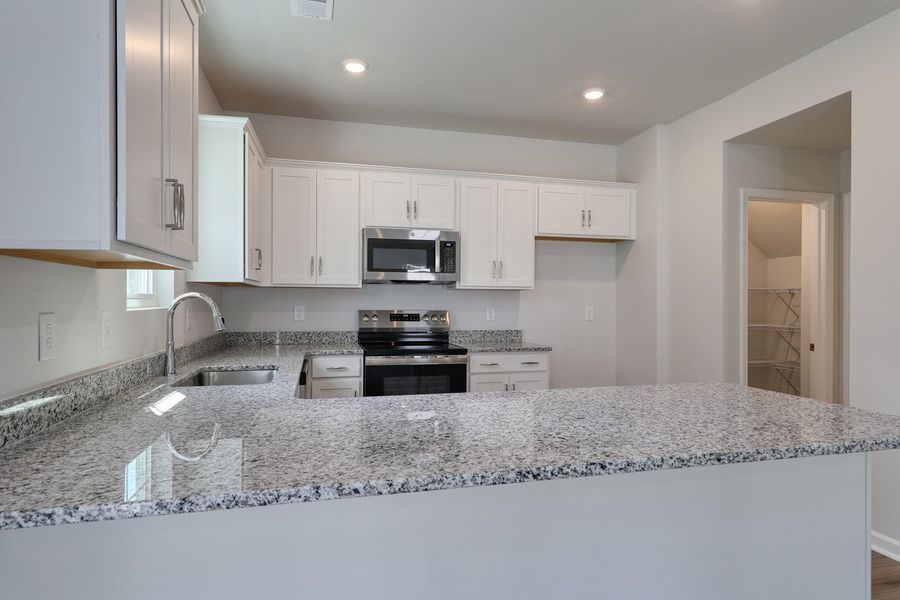 Furnished interior view inside a new home in Hainer Place, Conway (Image 6).