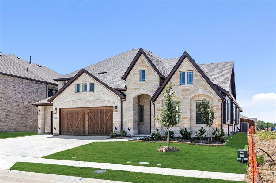 Front exterior of a new home in Chaparral Park, Oak Point, TX, highlighting curb appeal (Image 20). Front exterior of a new home in Chaparral Park, Oak Point, TX, highlighting curb appeal (Image 20).