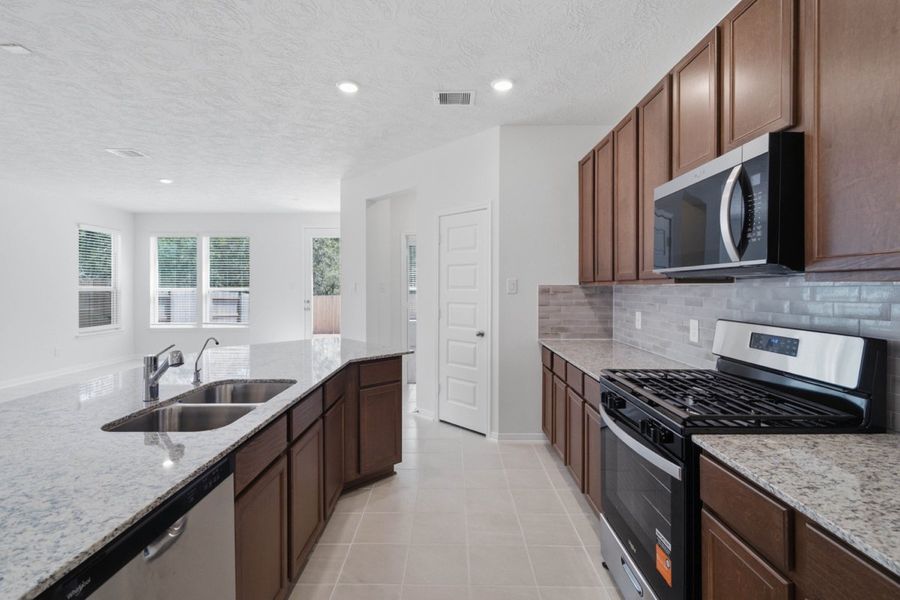 Furnished interior view inside a new home in Mustang Ridge, Magnolia (Image 6).