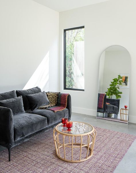 Living area with finished concrete floors and baseboards