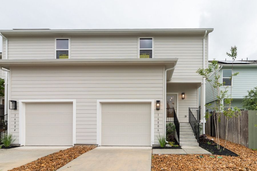 Front exterior of a new home in Whisper Valley, Manor, TX, highlighting curb appeal (Image 2). Front exterior of a new home in Whisper Valley, Manor, TX, highlighting curb appeal (Image 2).