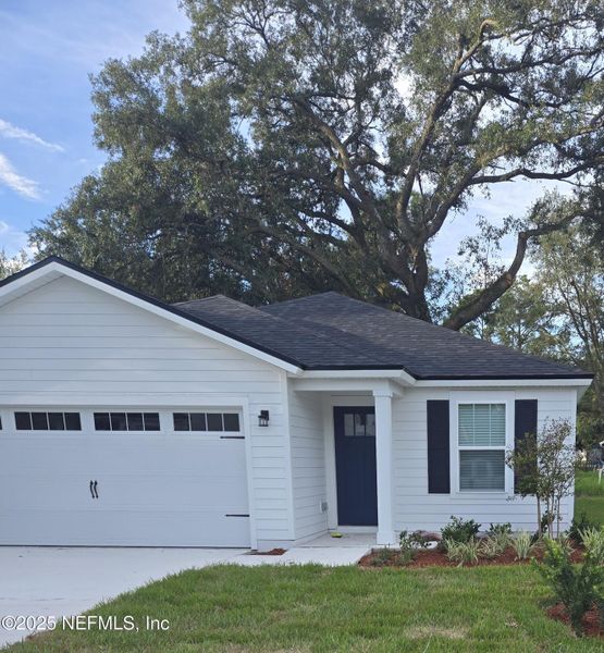Front exterior of a new home in , Jacksonville, FL, highlighting curb appeal (Image 1).