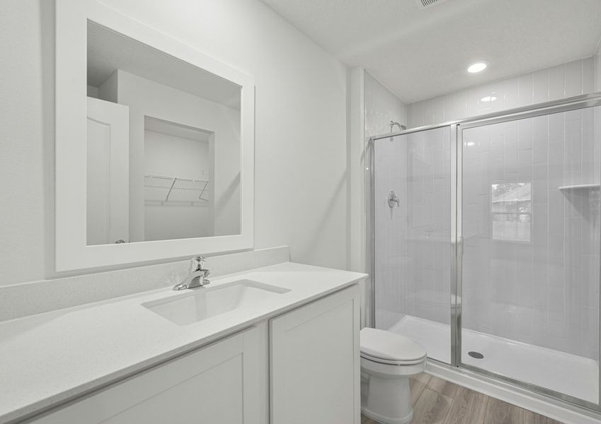 The master bathroom has a large walk in shower