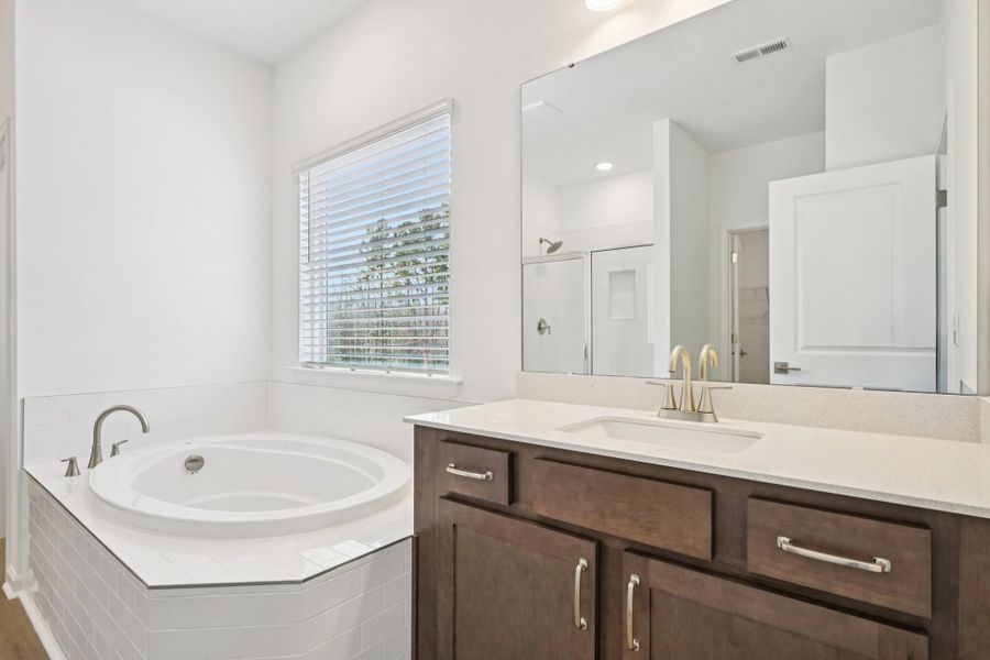 Primary Bath featuring the AW Collection® Roosevelt - Elegant tile and bold hardware finishes.