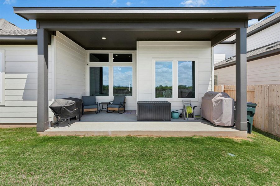 Back of house with a patio area