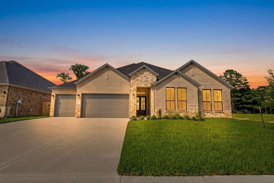 Front exterior of a new home in Friendswood Trails 70' Homesites, Friendswood, TX, highlighting curb appeal (Image 18).