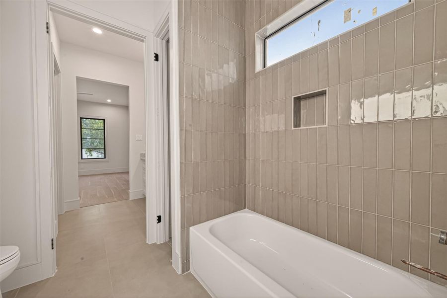 Spacious tub with beautiful tile