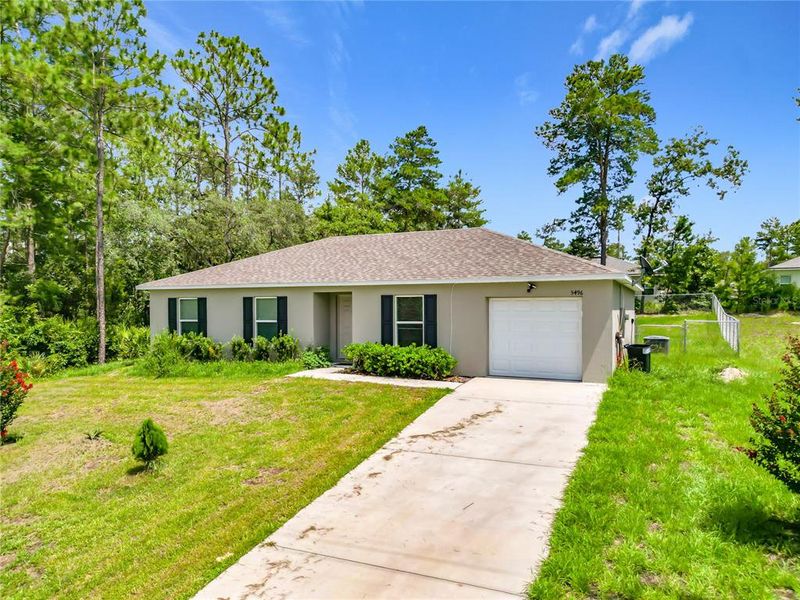 Front exterior of a new home in Ocala, Ocala, FL, highlighting curb appeal (Image 2). Front exterior of a new home in Ocala, Ocala, FL, highlighting curb appeal (Image 2).