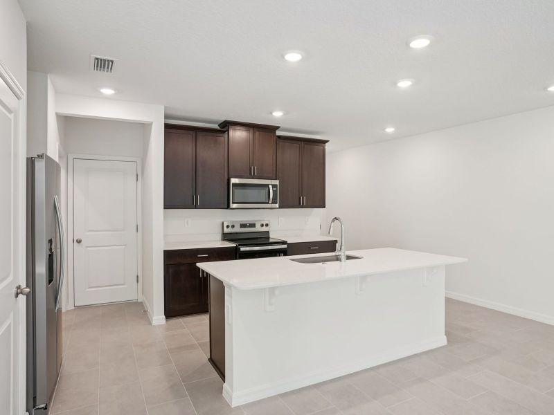 Furnished interior view inside a new home in The Meadow at Crossprairie Townes, St. Cloud (Image 3).