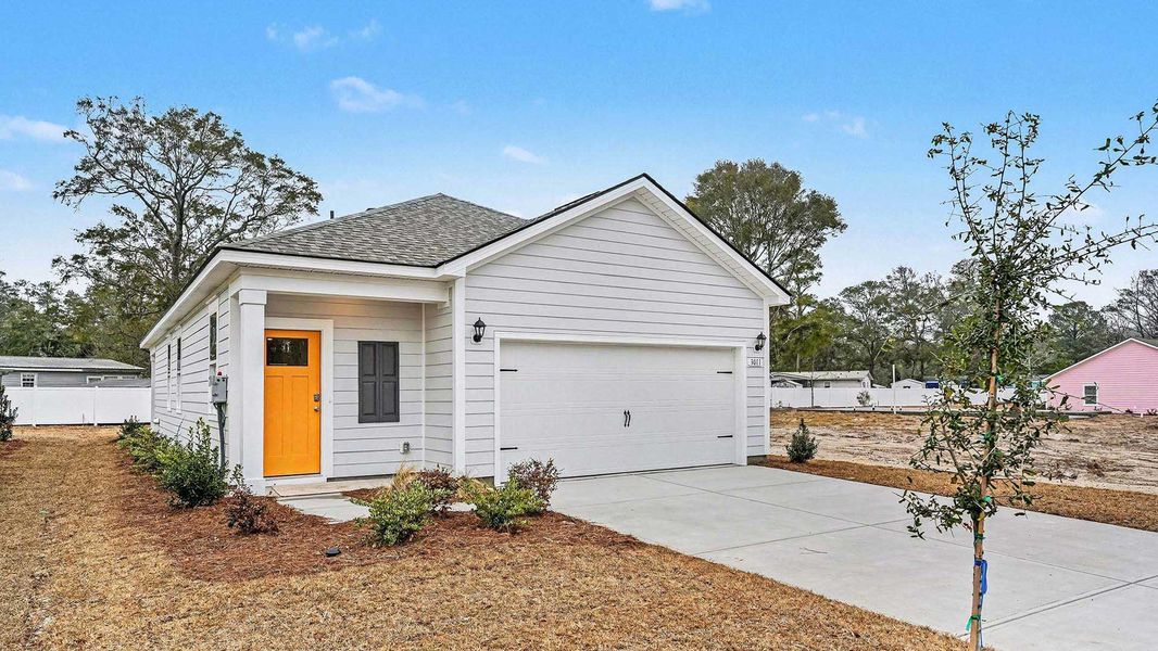 Front exterior of a new home in Pinewood Estates, Conway, SC, highlighting curb appeal (Image 2).