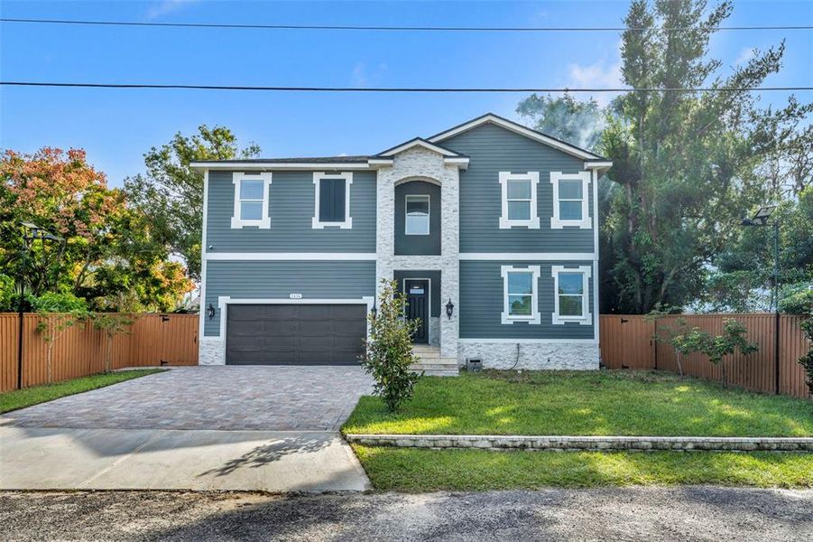 Front exterior of a new home in , Apopka, FL, highlighting curb appeal (Image 1).