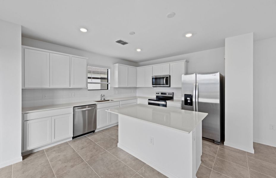 Furnished interior view inside a new home in Caloosa Cove, Labelle (Image 5).