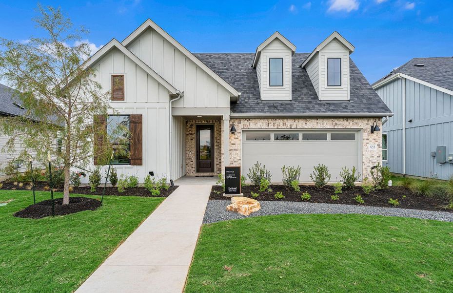 Representative exterior photo of a completed home built from the Prestige by Del Webb in Del Webb Austin at Lost Pines, Bastrop, TX (Image 31).