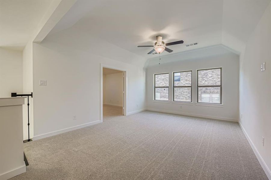 Unfurnished room with light carpet and a ceiling fan Unfurnished room with light carpet and a ceiling fan