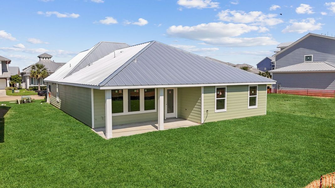 Representative exterior photo of a completed home built from the JUSTIN by D.R. Horton in Grand Cay Harbour, Texas City, TX (Image 2).
