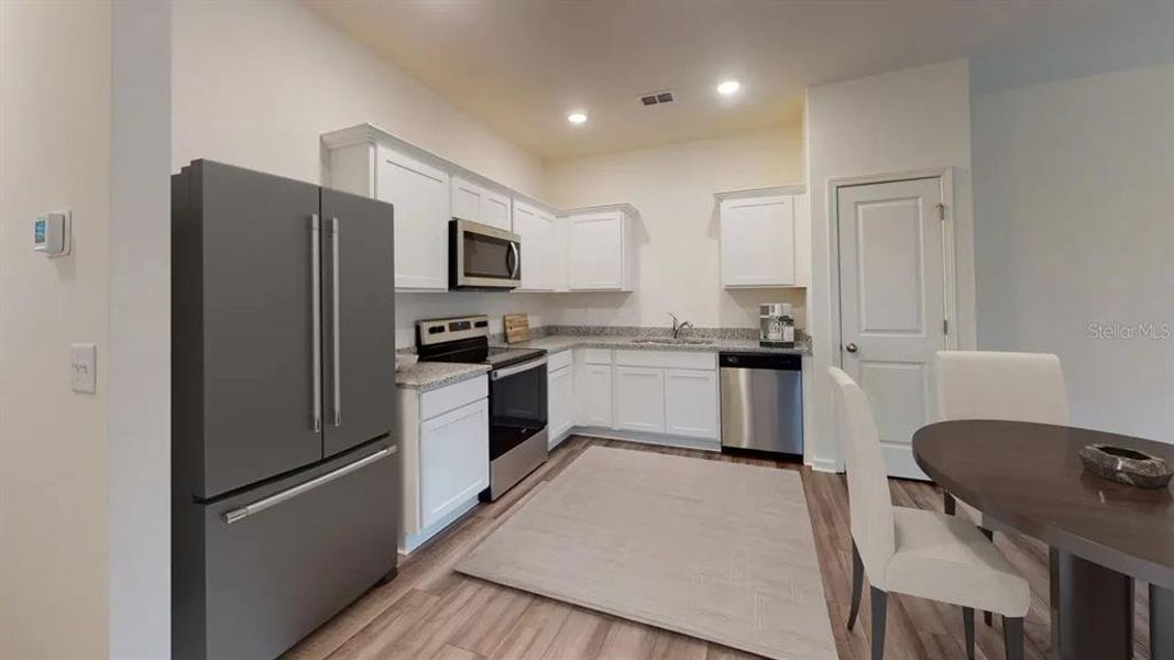 Furnished interior view inside a new home in , Dade City (Image 11).