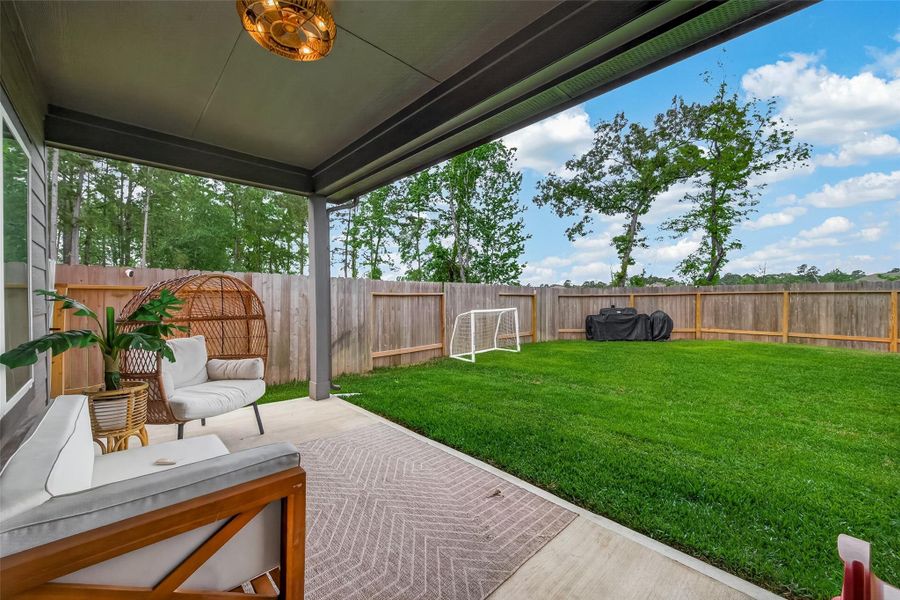 Exterior details and patio area of a home in Grand Pines, Magnolia (Image 26).
