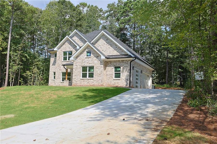 Front exterior of a new home in , McDonough, GA, highlighting curb appeal (Image 23).