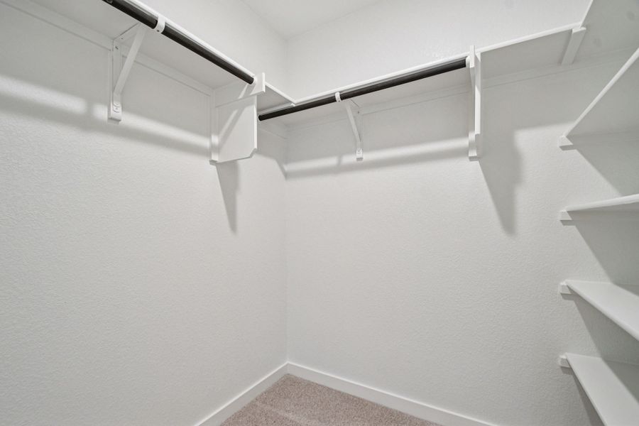 A white staircase with a white railing.