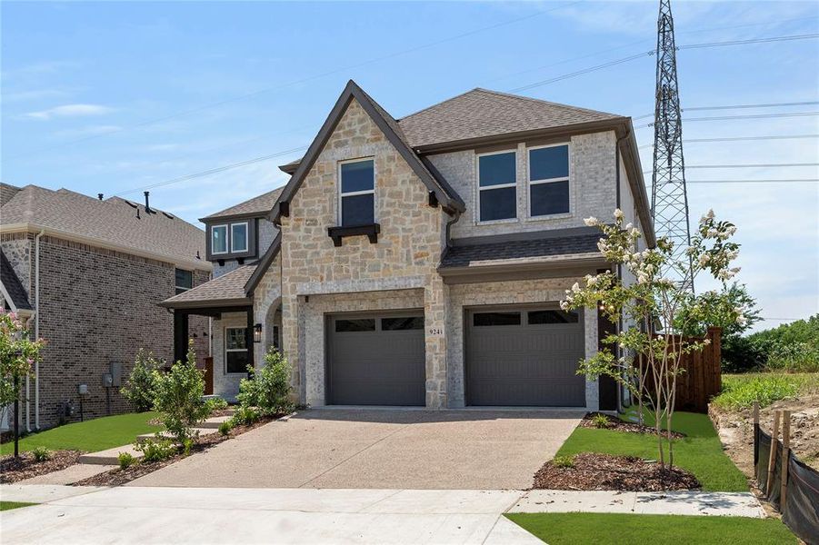 Front exterior of a new home in Inspiration, Seis Lagos, TX, highlighting curb appeal (Image 22).