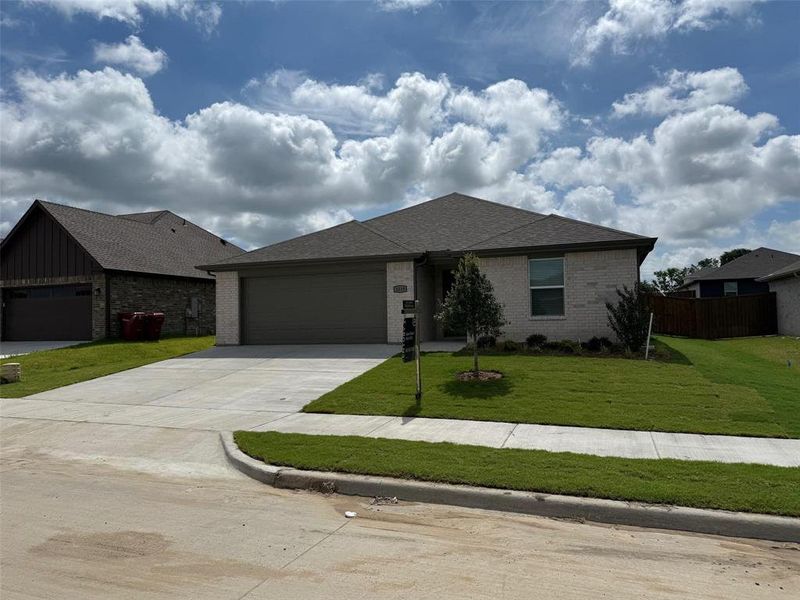 Front exterior of a new home in , Sherman, TX, highlighting curb appeal (Image 17).