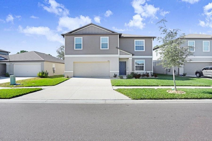 Front exterior of a new home in , Zephyrhills, FL, highlighting curb appeal (Image 2). Front exterior of a new home in , Zephyrhills, FL, highlighting curb appeal (Image 2).