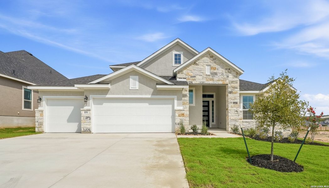 Front exterior of a new home in The Reserve at Potranco Oaks, Castroville, TX, highlighting curb appeal (Image 2). Front exterior of a new home in The Reserve at Potranco Oaks, Castroville, TX, highlighting curb appeal (Image 2).
