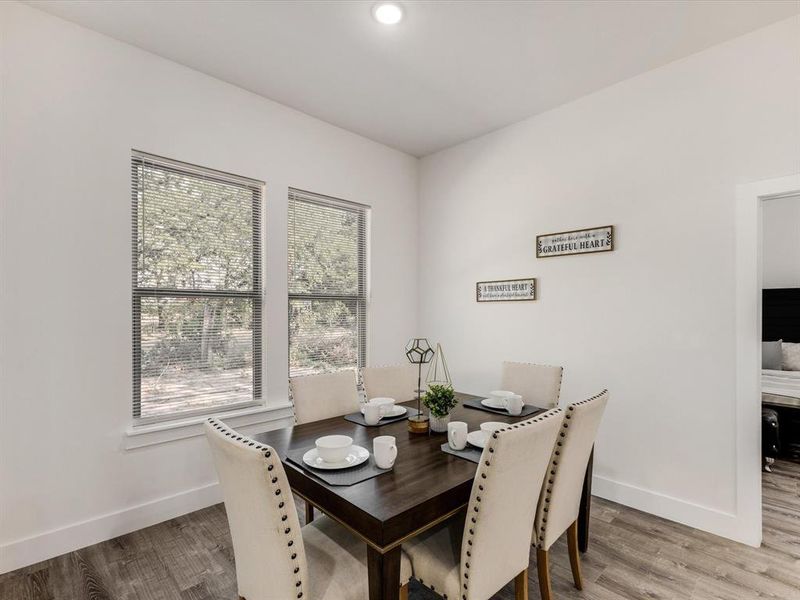 Dining area featuring light wood-type flooring and recessed lighting