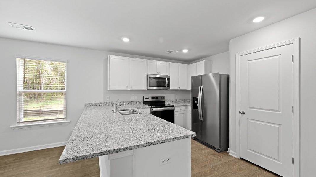 Furnished interior view inside a new home in Pine Hills at Cane Bay, Summerville (Image 4).