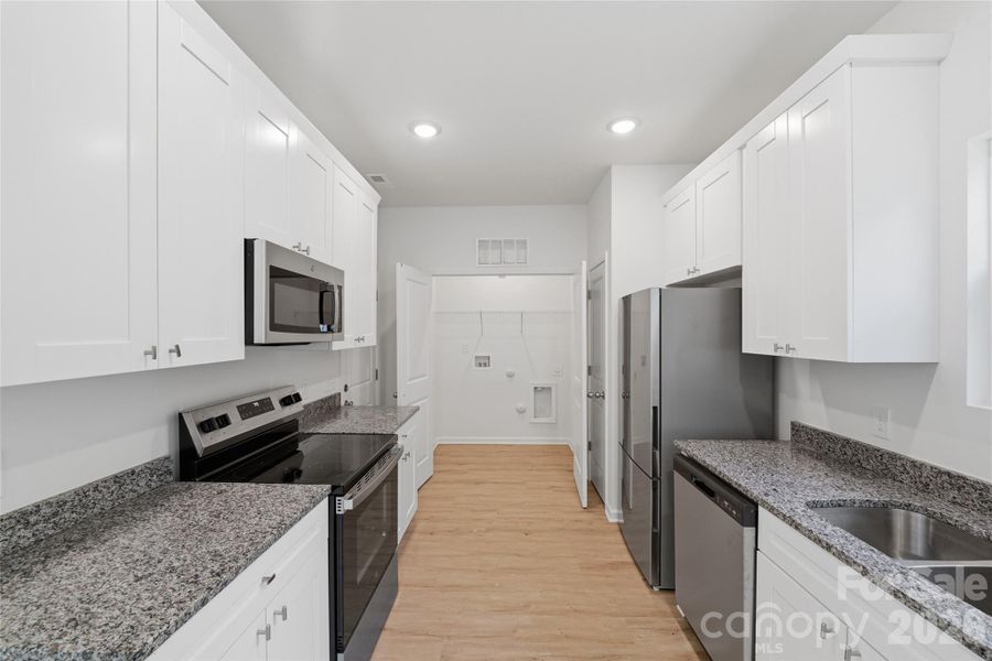 Furnished interior view inside a new home in , Statesville (Image 8).