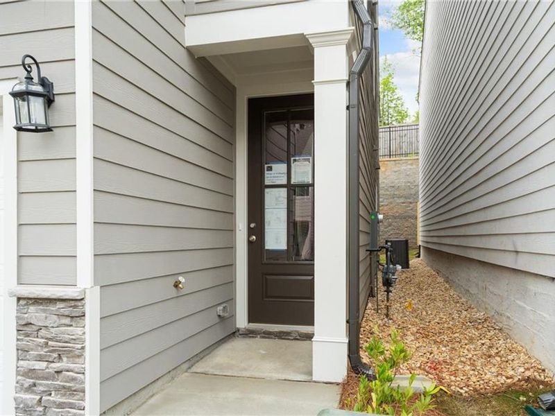 Exterior details and patio area of a home in The Village at Shallowford, Kennesaw (Image 1).