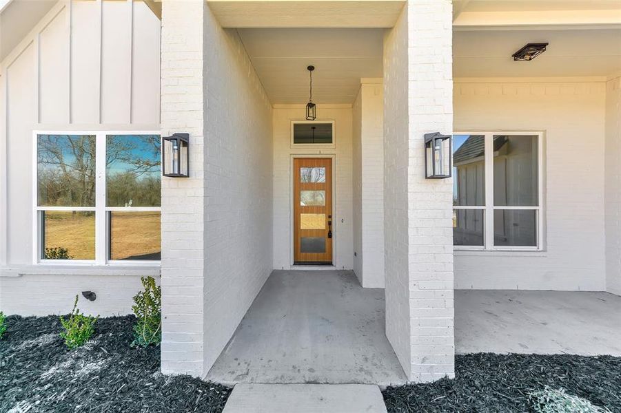 Exterior details and patio area of a home in , Poolville (Image 3).