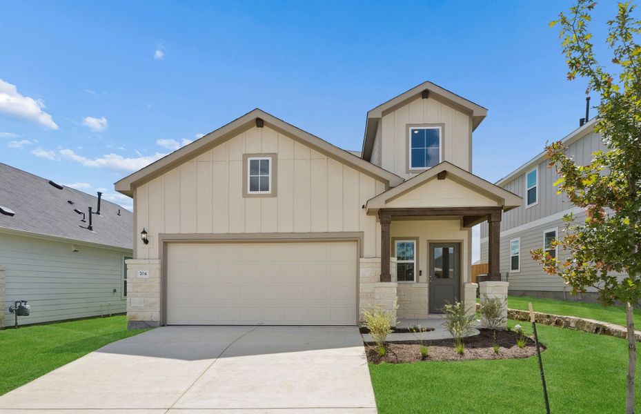 Front exterior of a new home in Sunfield, Buda, TX, highlighting curb appeal (Image 20).