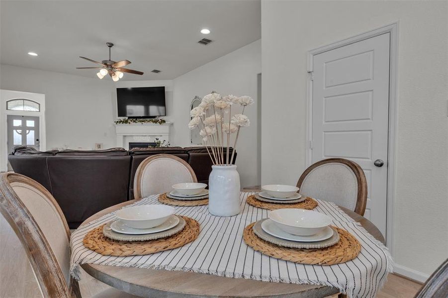 Dining area featuring a round table, light-toned walls, and recessed lighting Dining area featuring a round table, light-toned walls, and recessed lighting
