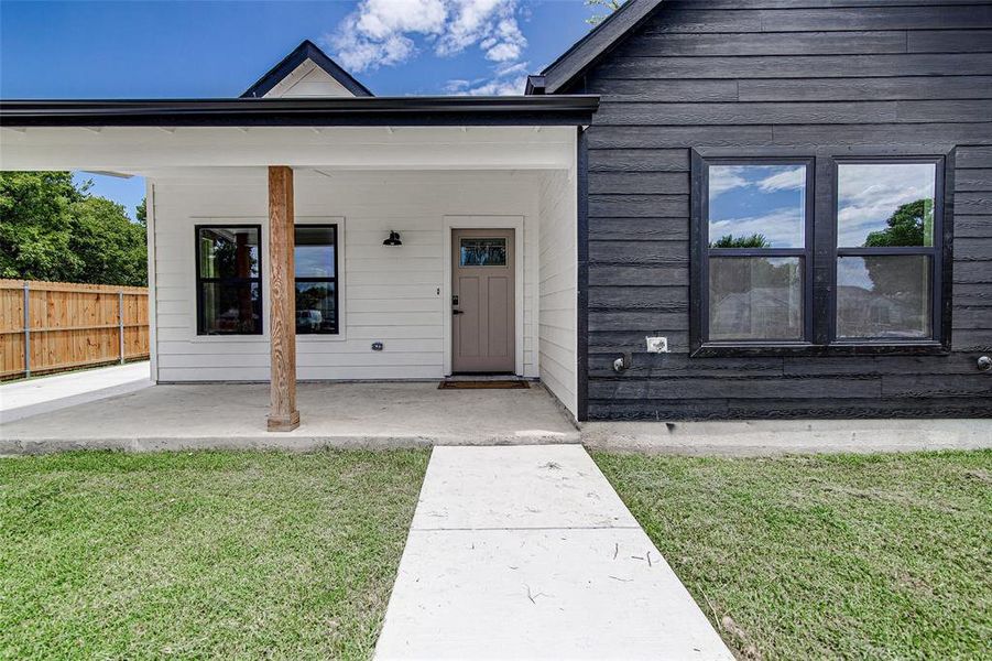 Property entrance featuring a patio