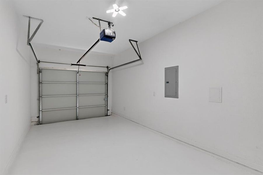 Garage with electric panel and a garage door opener Garage with electric panel and a garage door opener