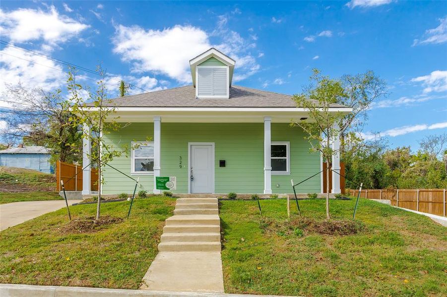 Bungalow-style house with covered porch and a front lawn